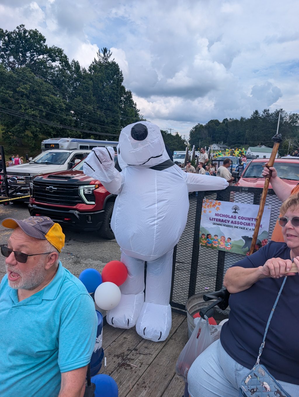 Tony Nichols dressed as Snoopy waves to the crowd.