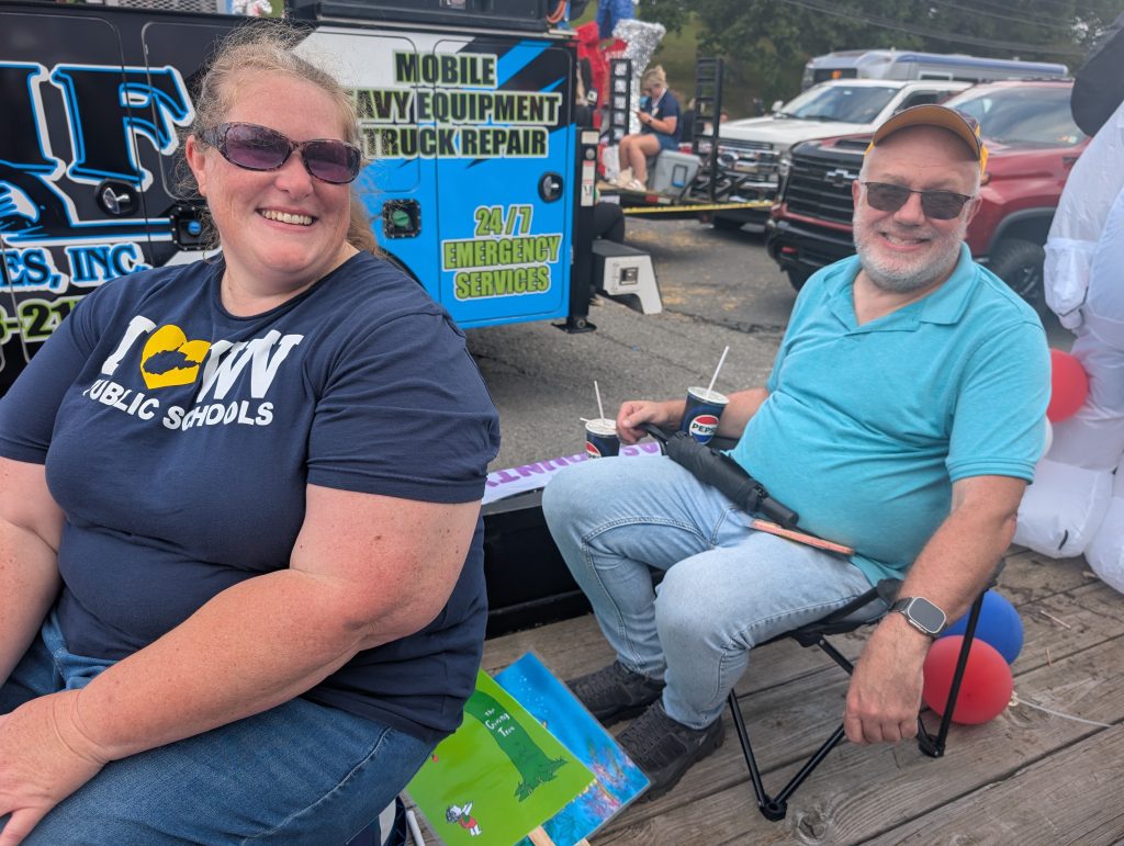 NCLA President Jennifer Davis and WVRA President Brian Bailey riding on the NCLA float at the 2026 Potato Festival.